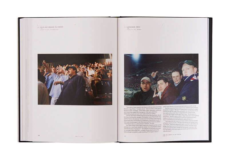 Still life image of an open hardcover book showing a picture of many people standing on a tribune on the left page and printed text and a picture of four men on the stands of a full stadium, wearing Stone Island jackets on the right page.