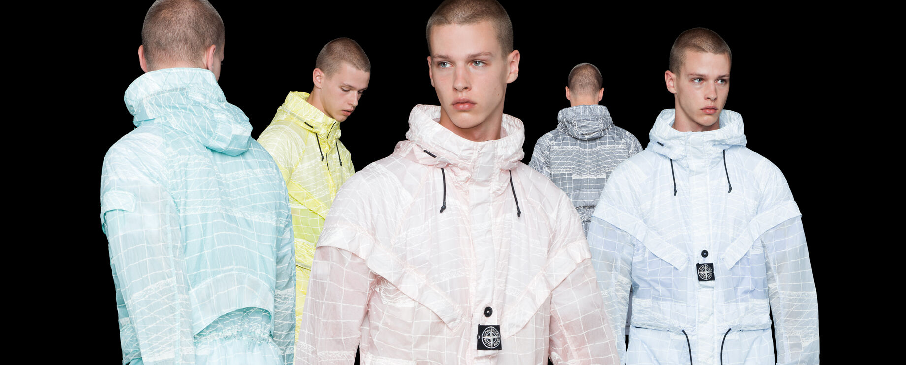 Five shots of the same model showing the front, side and back of a hooded jacket in different colors, aqua blue, yellow, light pink, gray and light blue, all with a white print.