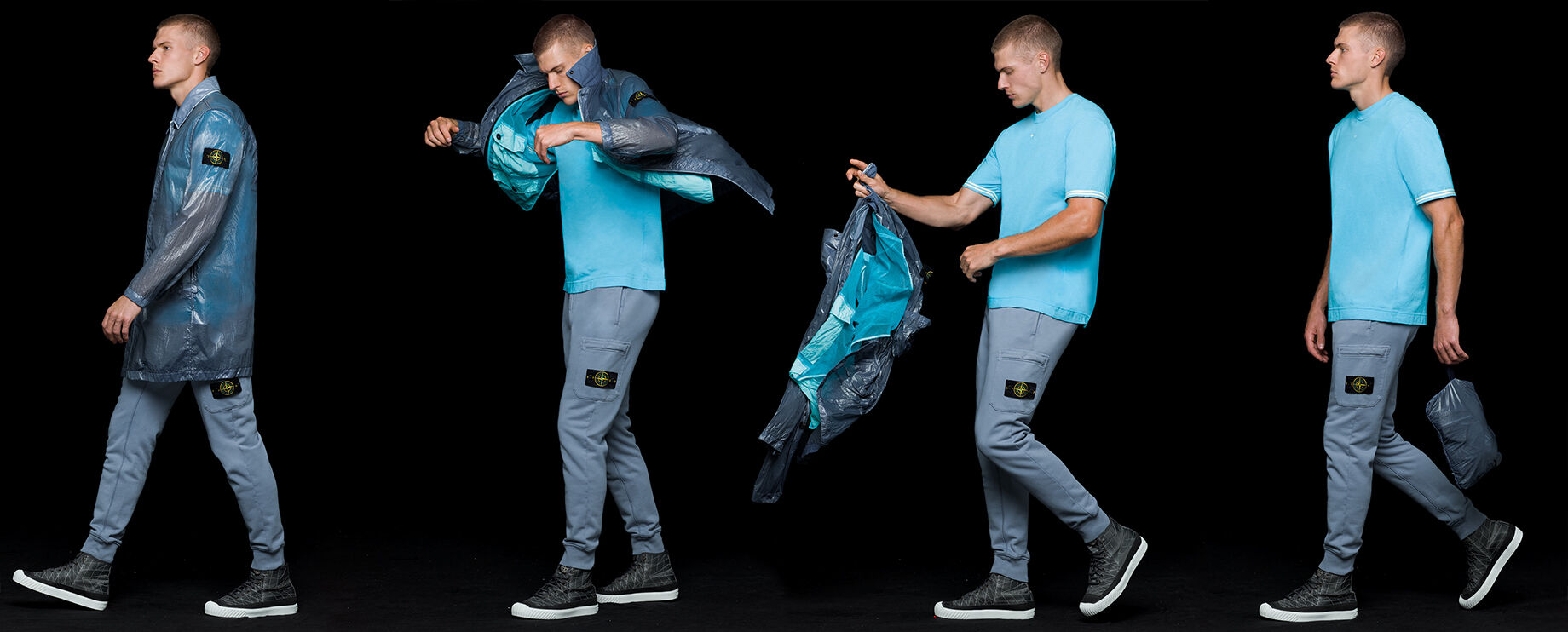 Four shots of the same model wearing gray blue joggers, a light blue crewneck T shirt and a gray blue shiny effect trench coat, showing that the coat is pocketable and can be stored in a carrying pouch.