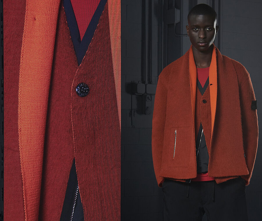 Model wearing a red and blue sweater under a two-tone orange coat, fastened by one button, beside an extreme close-up of the button.