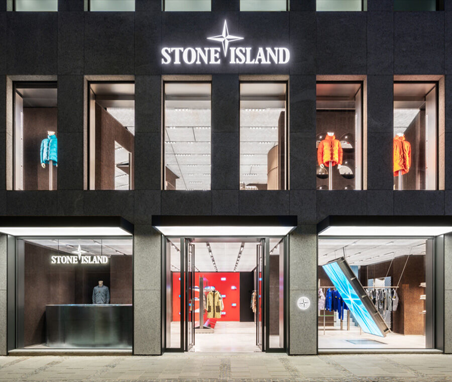 Stone Island Monaco store at night.